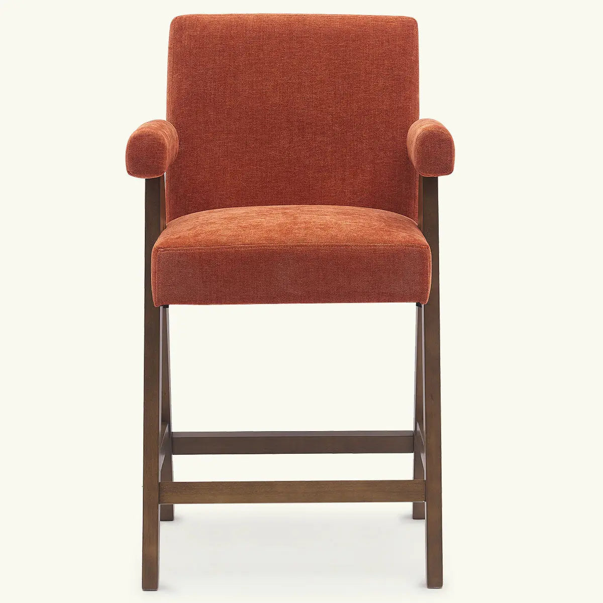 Morgan Mid Century Modern stool with arms, orange upholstery, wooden legs, minimalist setting.