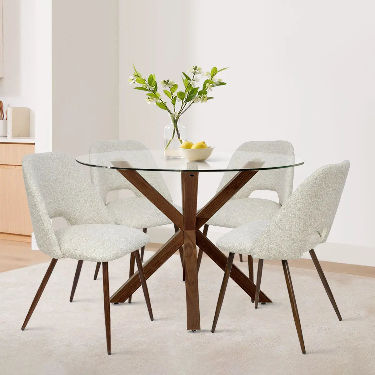 Oliver & Edwin dining table set with beige chairs, glass top, in modern dining room on light wood flooring.