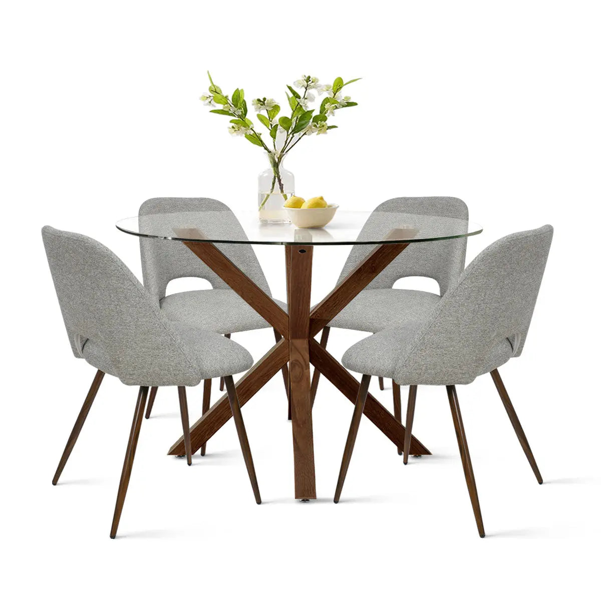 Oliver & Edwin round glass dining table set with gray chairs, wood legs, in modern styling.