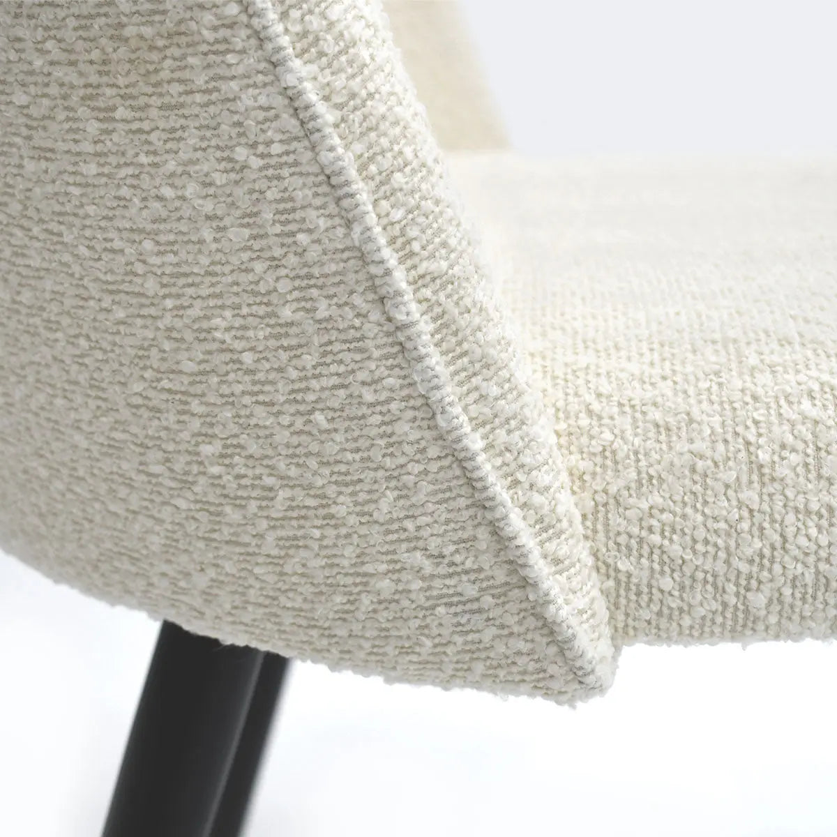 Close-up of Rhon Modern Boucle Upholstered Dining Chair texture with black legs, dimension detail available.