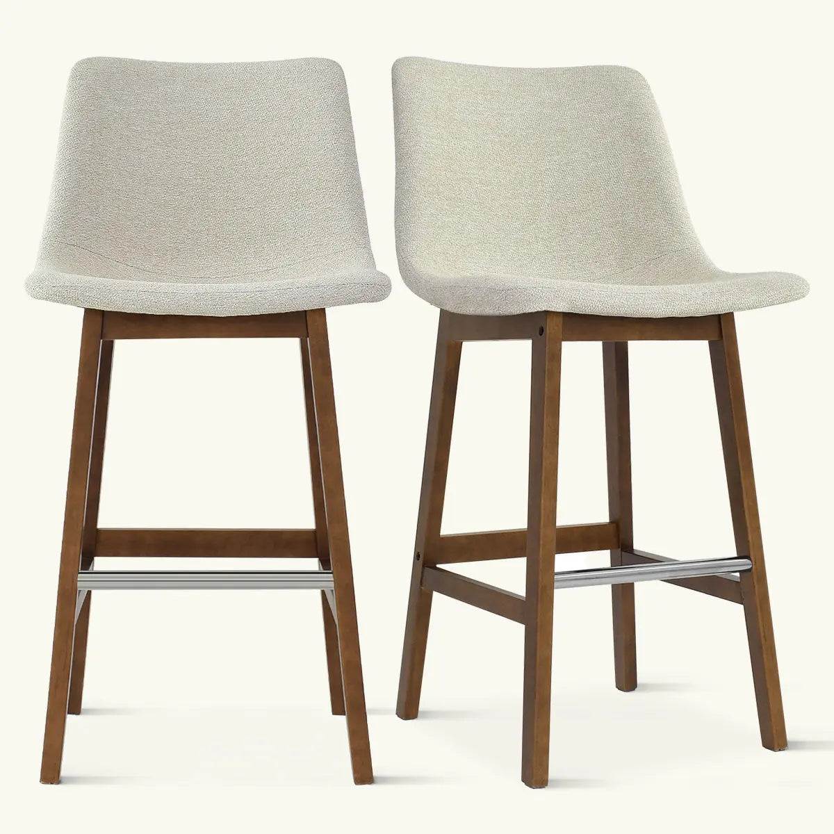 Pair of South Modern Upholstered Counter Stools with wood legs, beige upholstery, contemporary style.