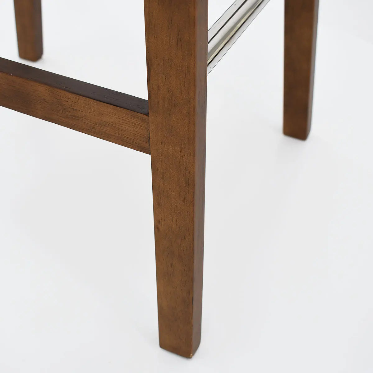 South Modern Upholstered Counter Stool's wooden legs with metal footrest on white background.