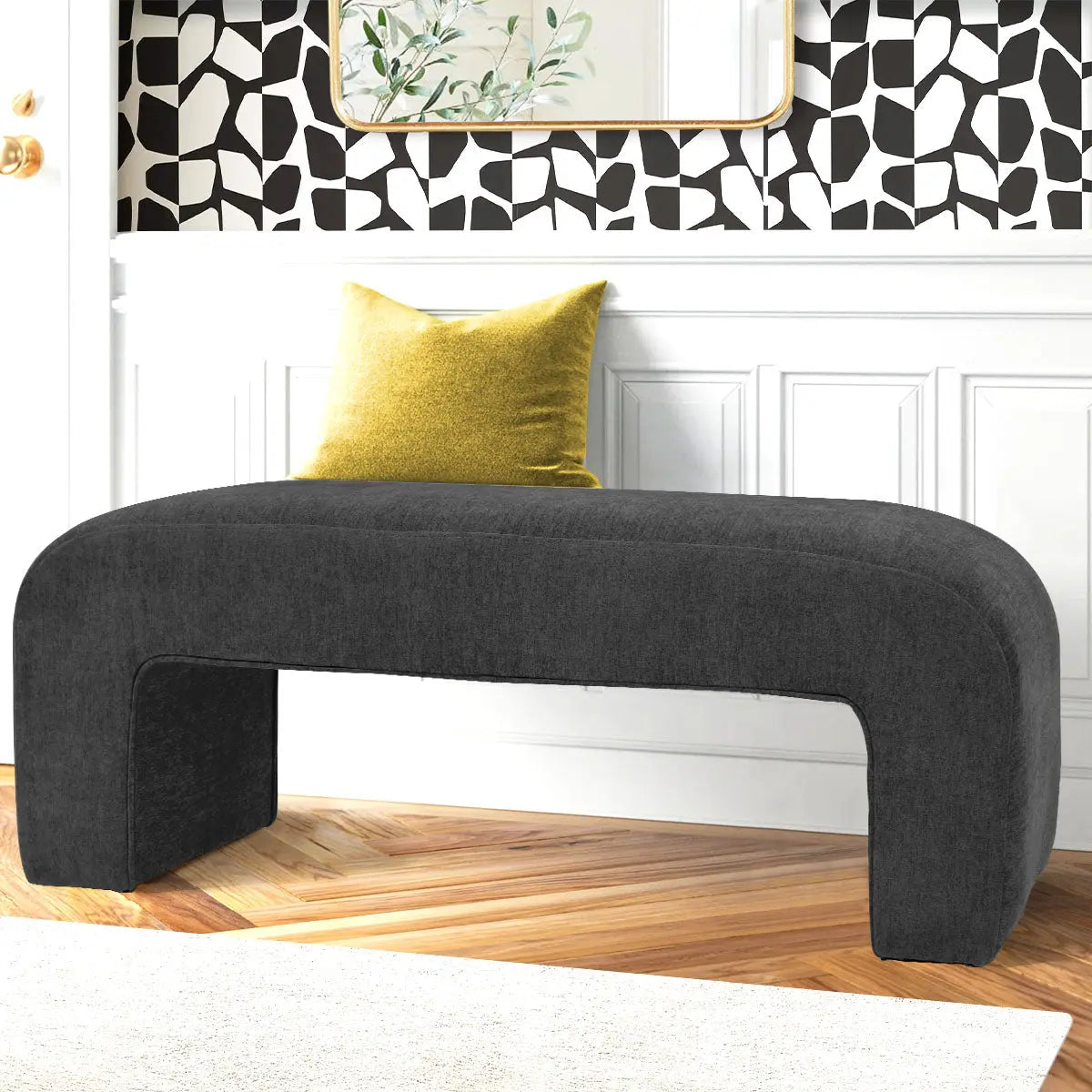 Lily Chenille Waterfall Bench in modern living room, bold wall design, wooden flooring, yellow cushion.