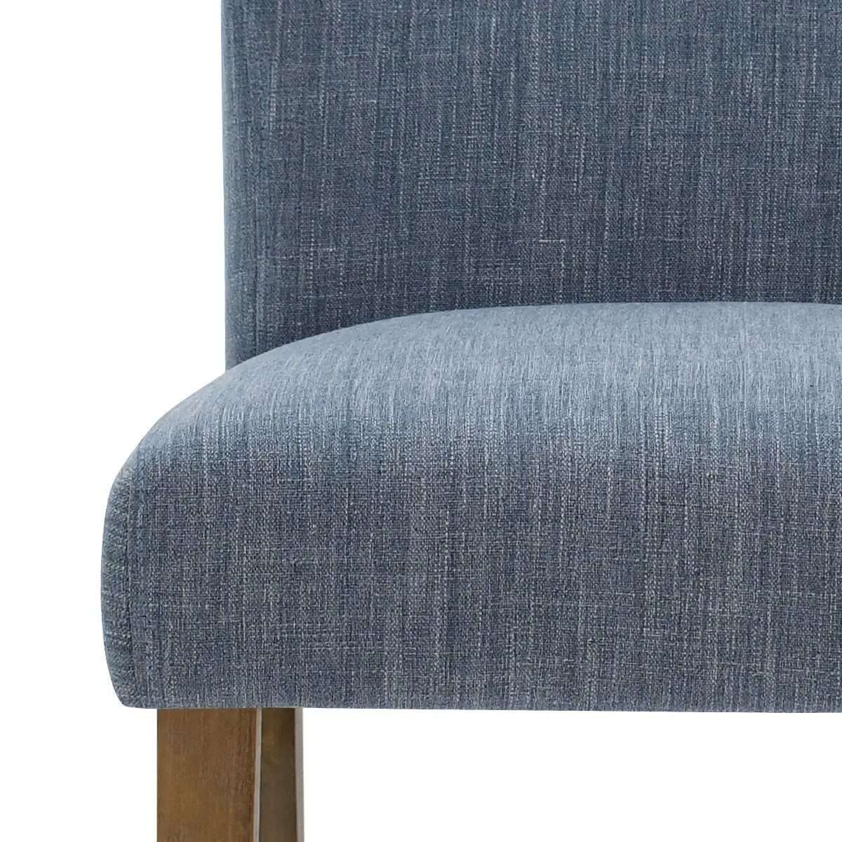 Blue North Upholstered Dining Chair with wooden legs, close-up detail.